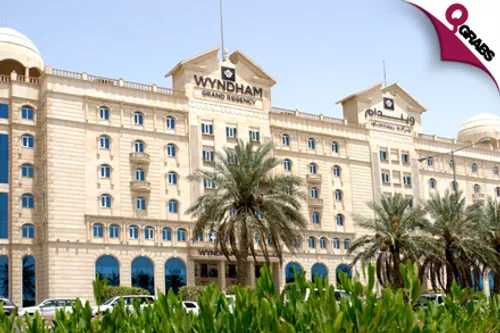 For QR850, Have a Romantic Night for TWO with Breakfast, PLUS  Choose Dinner OR Massage at Wyndham Grand Regency Doha! (QR1700 Value)